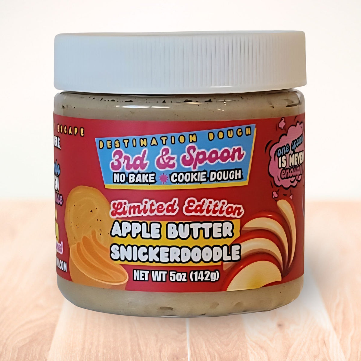 5 oz jar of 3rd & Spoon apple butter snickerdoodle edible cookie dough on a light wooden counter