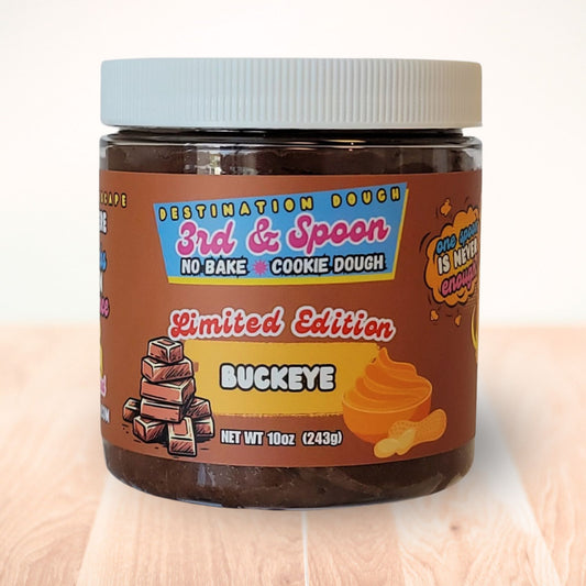 10 oz jar of 3rd & Spoon buckeye edible cookie dough on a light wooden counter