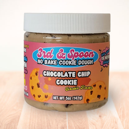 5 oz jar of 3rd & Spoon chocolate chip edible cookie dough on a light wooden counter