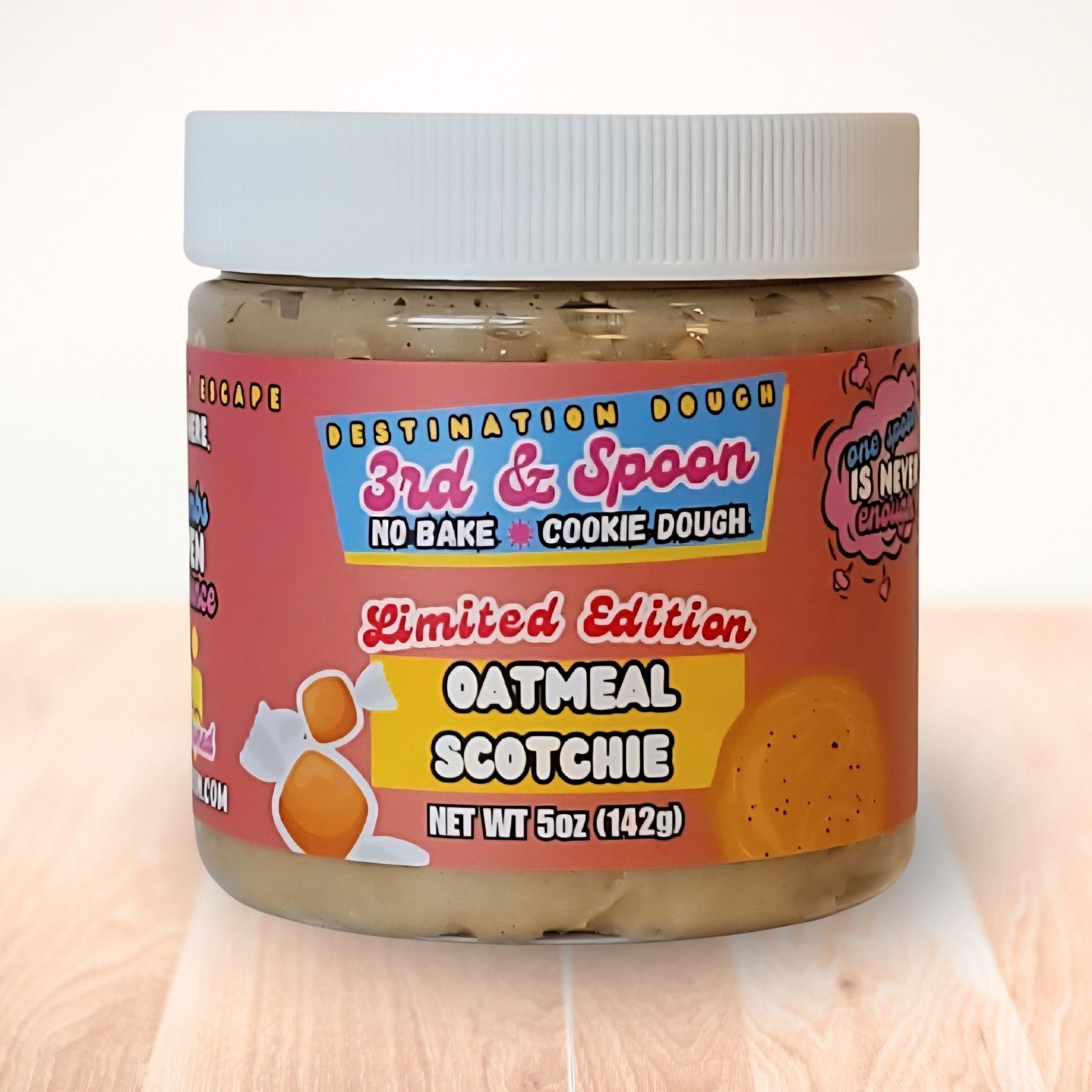 5 oz jar of 3rd & Spoon oatmeal scotchie edible cookie dough on a light wooden counter