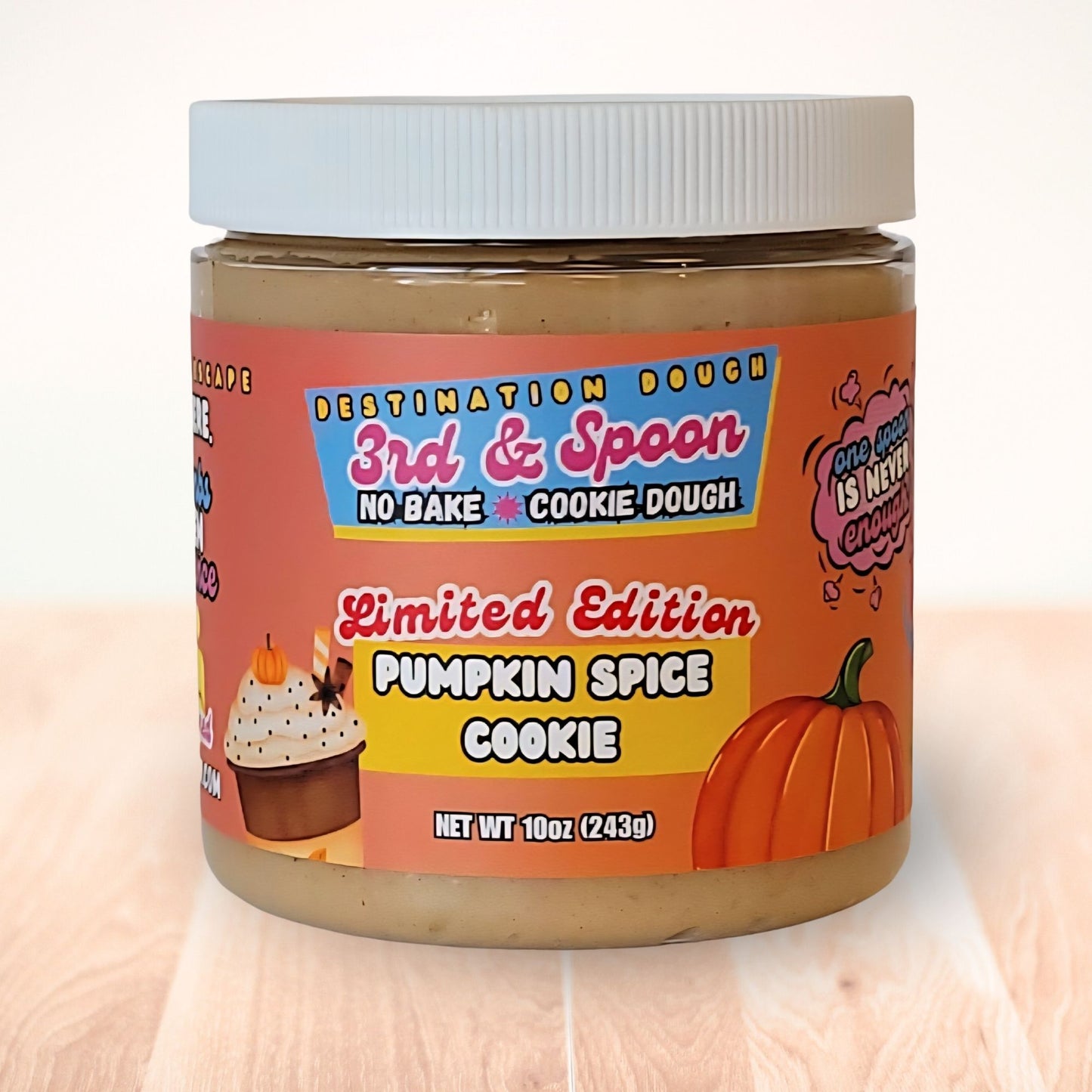 10 oz jar of 3rd & Spoon pumpkin spice cookie edible cookie dough on a light wooden counter