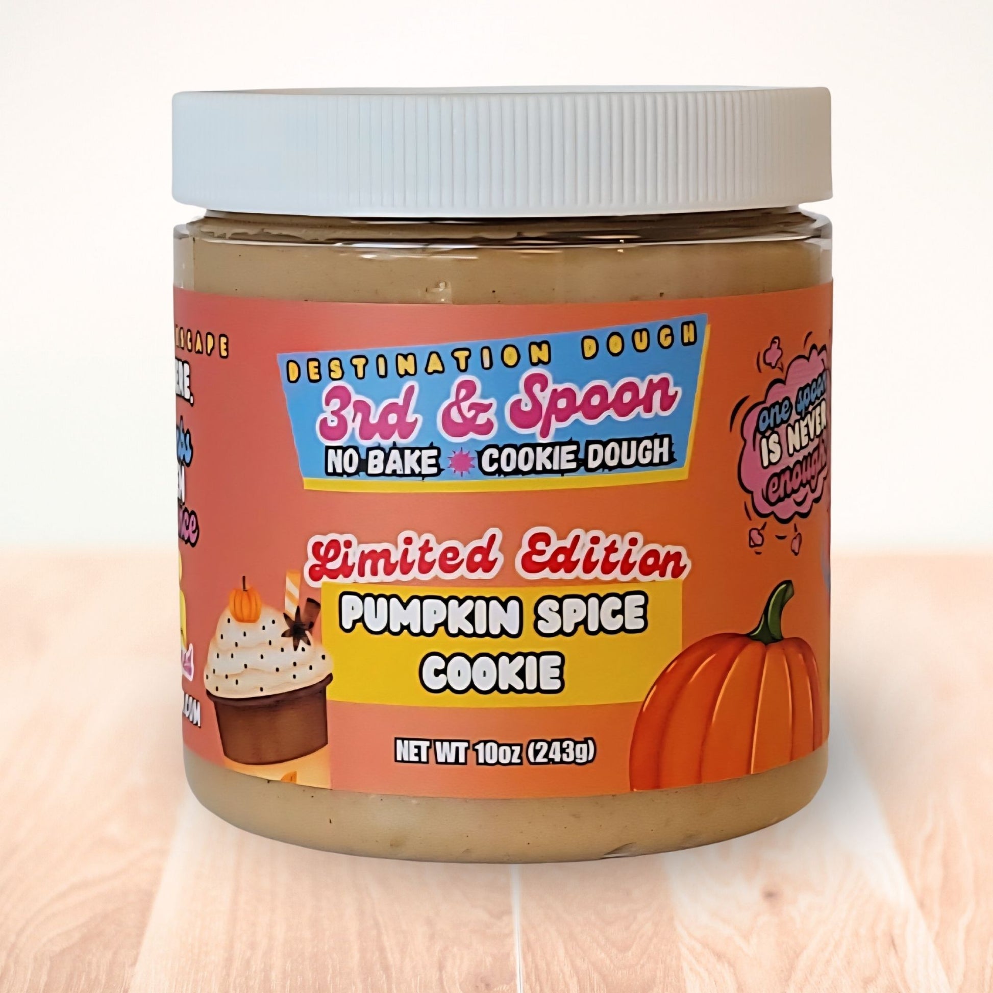 10 oz jar of 3rd & Spoon pumpkin spice cookie edible cookie dough on a light wooden counter