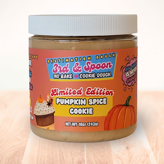 10 oz jar of 3rd & Spoon pumpkin spice cookie edible cookie dough on a light wooden counter