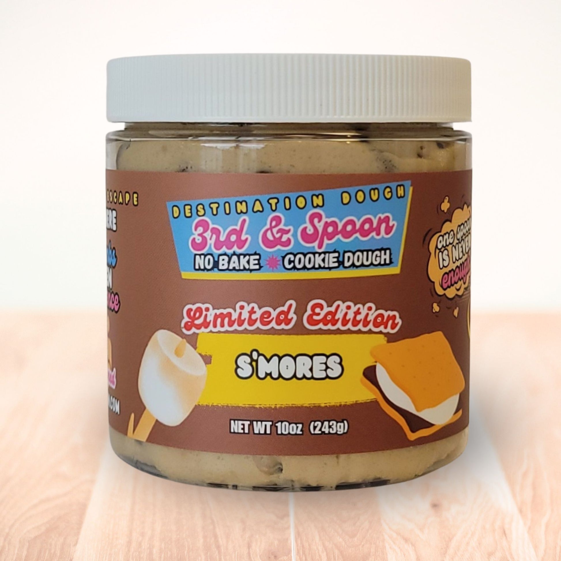5 oz jar of 3rd & Spoon s'mores edible cookie dough on a light wooden counter