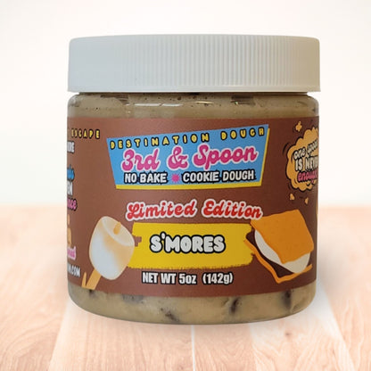 10 oz jar of 3rd & Spoon s'mores edible cookie dough on a light wooden counter
