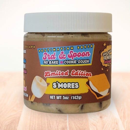 10 oz jar of 3rd & Spoon s'mores edible cookie dough on a light wooden counter