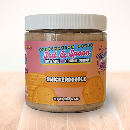 10 oz jar of 3rd & Spoon snickerdoodle edible cookie dough on a light wooden counter